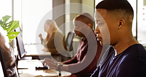 Business colleagues working on computer at desk 4k