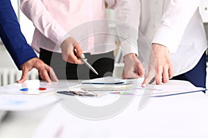 Business colleagues working with documents in modern office