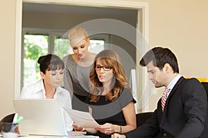 Business colleagues working on a laptop