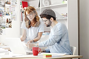 Business colleagues working on a laptop