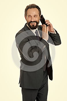 Business communications. Wait a minute. Busy with conversation. Businessman formal suit holds smartphone. Man bearded