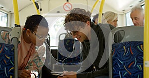 Business commuter talking on mobile phone while travelling in bus 4k