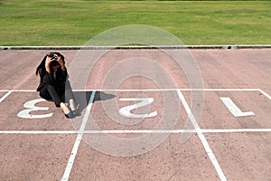 Business competition: businesswoman is the loser on number 3 at start line