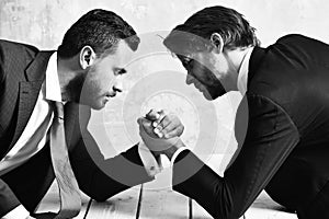 Business competition concept Businessmen arm wrestling in office