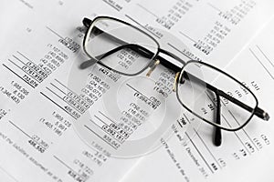 Financial analysis - income statement, business plan with glass photo