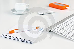 Business Composition on white Desk orange Items