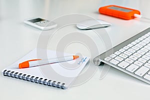 Business Composition on white Table orange Items