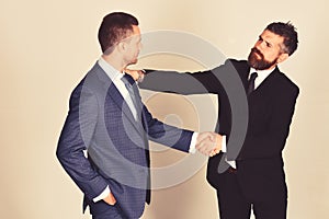 Business and compromise concept. Executives shake hands in agreement