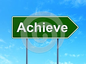 Business concept: Achieve on road sign background
