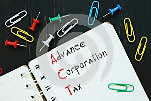 Business concept about Advance Corporation Tax ACT with inscription on the sheet