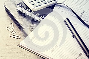 Business concept with agenda, mobile phone and calculator