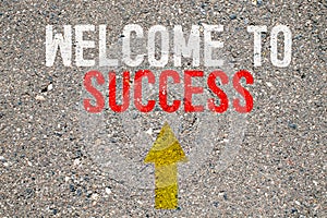 Business concept. On the asphalt road markings an arrow with the inscription - WELCOME TO SUCCESS