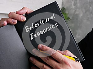 Business concept about Behavioural Economics with phrase on the page photo