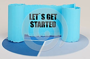 On the blue diagram is a twisted paper sign with the inscription - LET IS GET STARTED