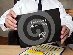 Business concept about Budgeting Money Tips 3 with inscription on the sheet