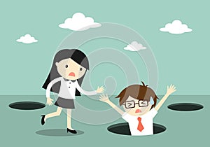 Business concept, Businessman fall into the hole but business woman trying to help him.