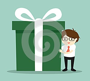 Business concept, Businessman holding a big gift box for Christmas festival.