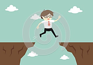 Business concept, businessman jump through the gap to another cliff.