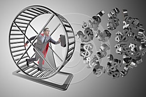 The business concept with businessman running on hamster wheel