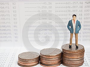 Business Concept. businessman small figures standing on calcula