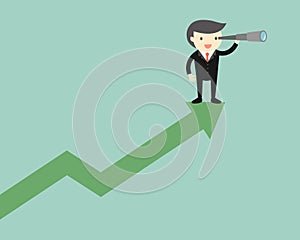 Business concept, Businessman is using his telescope while standing on the up chart.