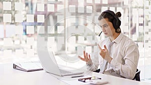 Business concept, Businessman wearing headphone to explain planning with team on video conference