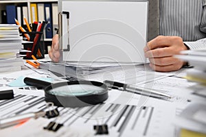 Business concept - businessman working with reports in office, table and workspace close view, analyzing financial data, writes