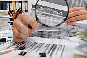 Business concept - businessman working with reports in office, table and workspace close view, analyzing financial data, writes