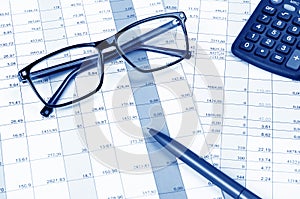 Business concept with calculator, pen, glasses