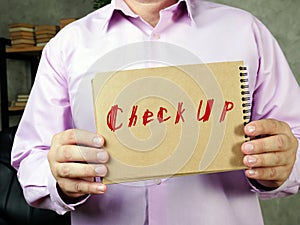 Business concept about Check Up  with inscription on the sheet