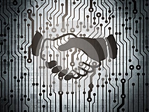 Business concept: circuit board with Handshake