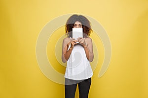 Business Concept - Close up Portrait young beautiful attractive African American smiling showing plain white blank sign