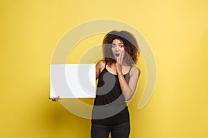 Business Concept - Close up Portrait young beautiful attractive African American smiling showing plain white blank sign