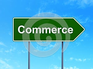 Business concept: Commerce on road sign background