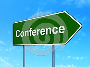 Business concept: Conference on road sign background