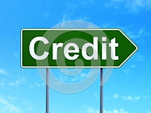 Business concept: Credit on road sign background