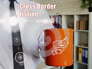 Business concept about Cross Border Listing with Man with a cup of coffee in the background