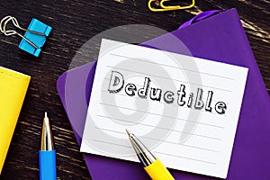 Business concept about Deductible with inscription on the piece of paper