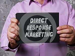 Business concept about DIRECT RESPONSE MARKETING with inscription on the piece of paper