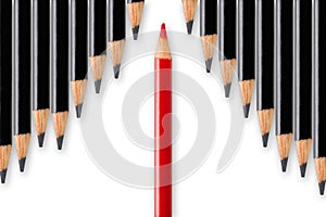 Business concept of disruption, leadership or think different; red pencil dividing row of black pencils in opposite direction