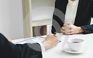 Business concept - Executives at desk discussion sales performance in a office