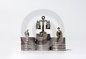 A business concept expressed in miniature and coins. photo