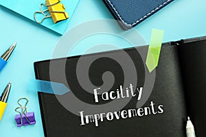 Business concept about Facility Improvements with inscription on the sheet