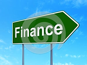 Business concept: Finance on road sign background