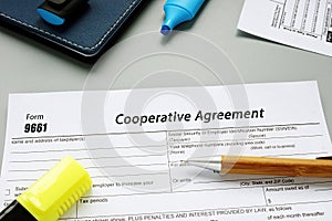 Business concept about Form 9661 Cooperative Agreement with sign on the sheet