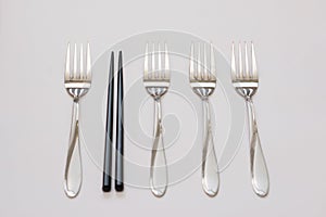 Business concept. Four forks and sticks and wooden sticks. Be different concept