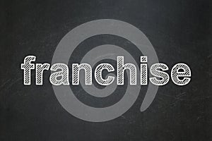 Business concept: Franchise on chalkboard background