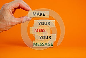 Business concept growth success process. Wood blocks on orange background, copy space. Businessman hand. Words `make your mess
