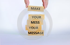 Business concept growth success process. Wood blocks on white background, copy space. Businessman hand. Words `make your mess you