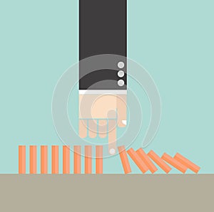 Business concept. Hand break domino crisis conceptuals.